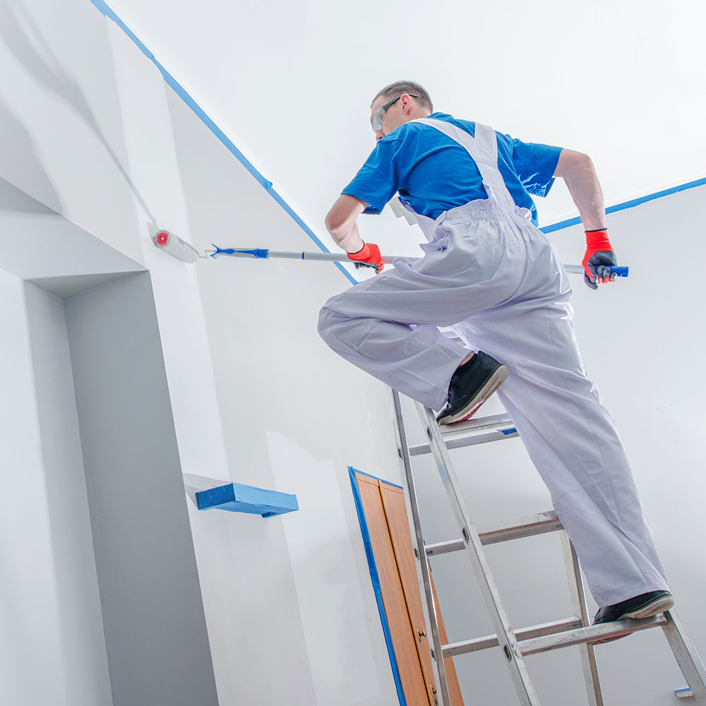 Man painting a house